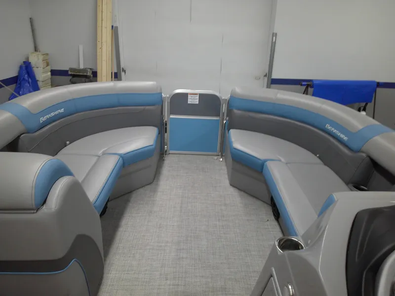 Slide: The Image of 2022 Berkshire 22CL2 CTS pontoon boat interior with gray and blue seating. - 8