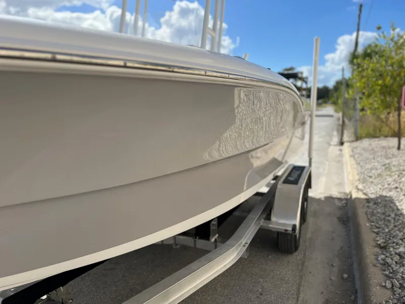 Slide: The Image of 2024 Clearwater 2000 boat on a trailer under a sunny sky. - 14