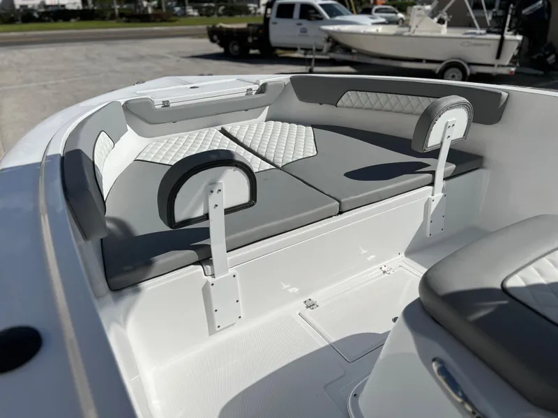 Slide: The Image of Clearwater 2000 2024 model boat with cushioned seating and backrests. - 15