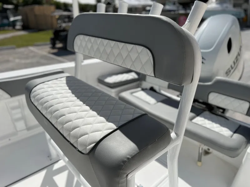 Slide: The Image of Clearwater 2000 2024 boat with cushioned seating and Suzuki outboard motor. - 16