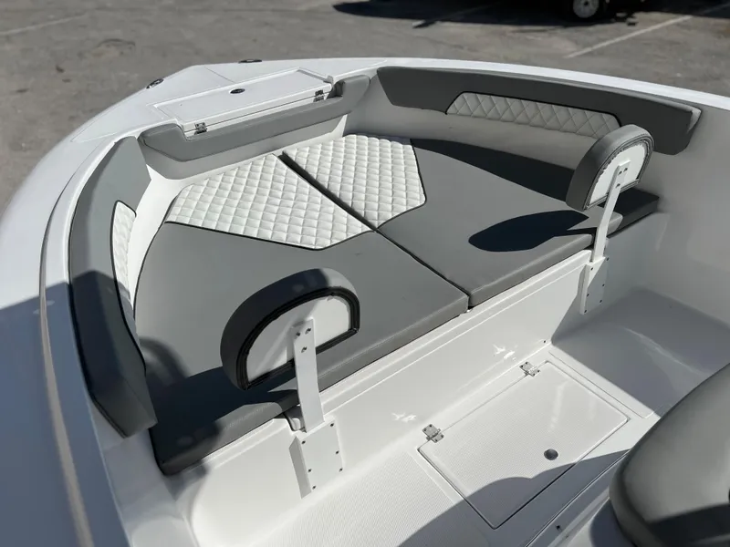 Slide: The Image of Interior seating of Clearwater 2000 boat, 2024 model, featuring gray and white cushioned seats. - 19