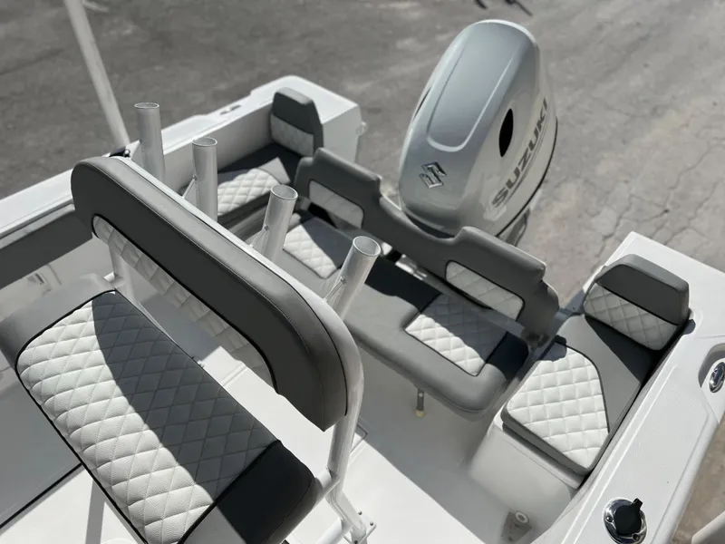 Slide: The Image of Clearwater 2000 2024 model boat interior with Suzuki outboard motor. - 24