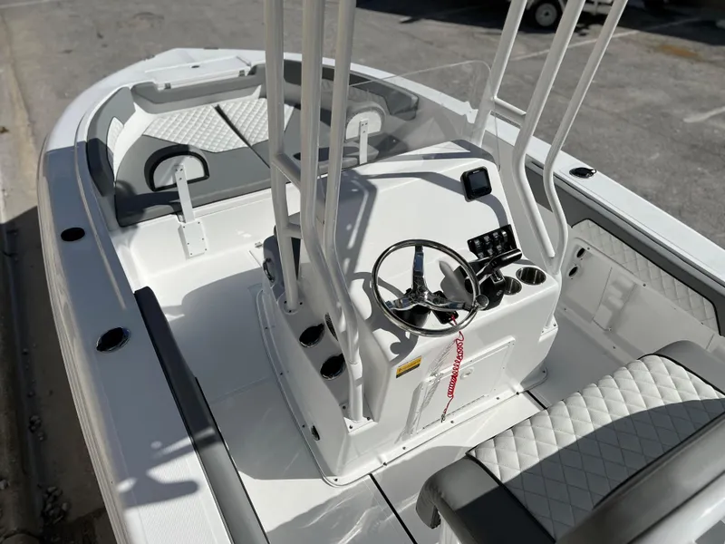 Slide: The Image of 2024 Clearwater 2000 boat interior with steering console and seating. - 26