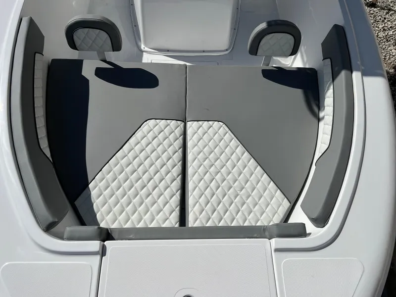 Slide: The Image of 2024 Clearwater 2000 boat interior with diamond-stitched seating and gray accents. - 27