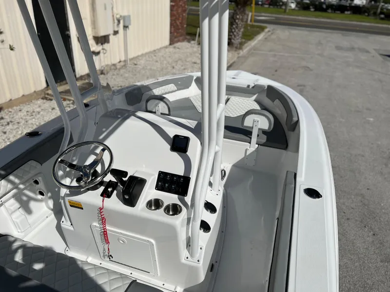 Slide: The Image of 2024 Clearwater 2000 boat interior with steering console and seating. - 31