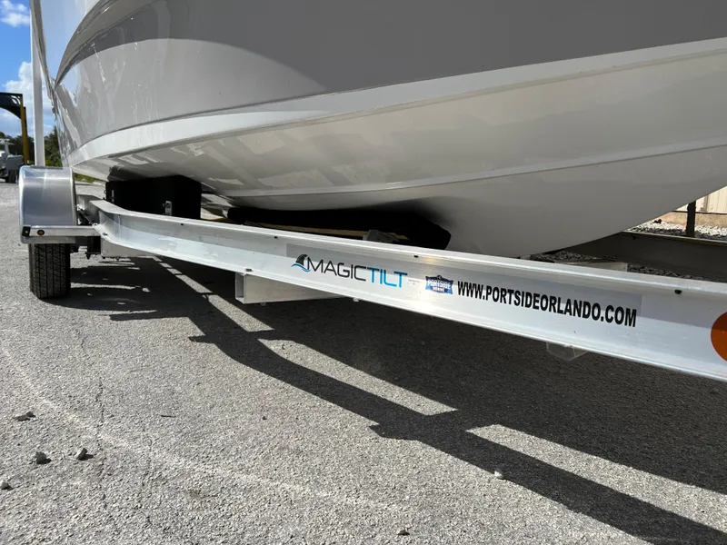 Slide: The Image of 2024 Clearwater 2000 boat on Magic Tilt trailer, Portside Orlando branding. - 32