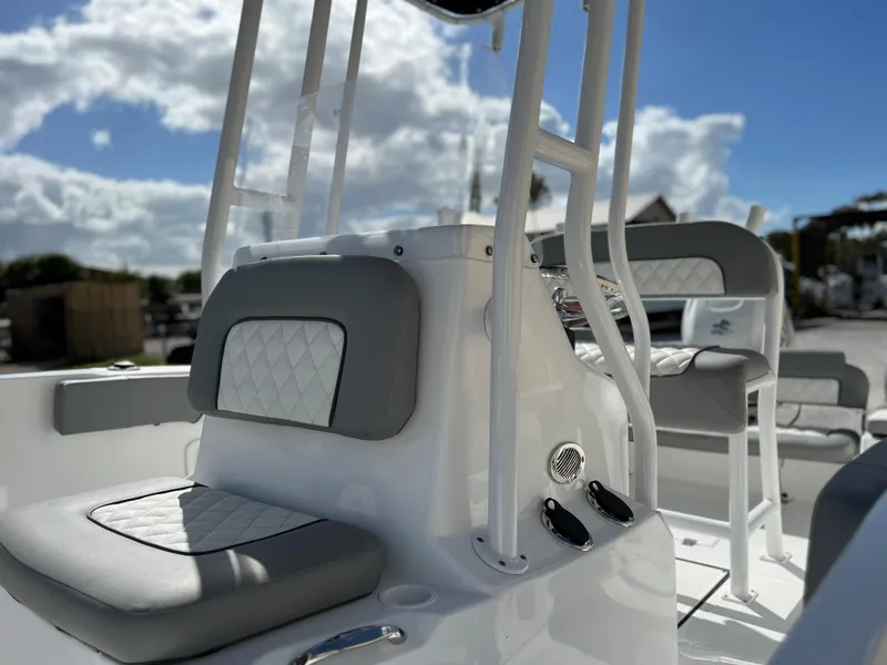 Slide: The Image of 2024 Clearwater 2000 boat interior with cushioned seating and console. - 33
