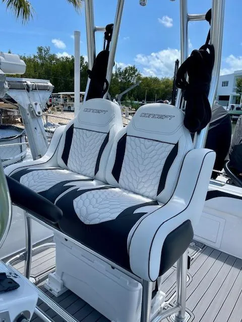 Slide: The Image of Luxury seating on 2023 Concept 27 boat, featuring stylish white and black upholstery. - 6