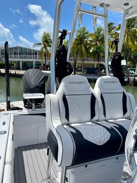 Slide: The Image of Luxury Concept 27 boat seats, 2023 model, docked with palm trees in the background. - 9