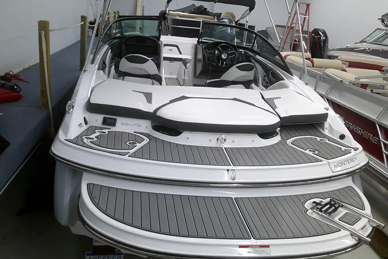 Slide: The Image of 2023 Monterey 224 FS Bowrider boat in showroom, rear view. - 15