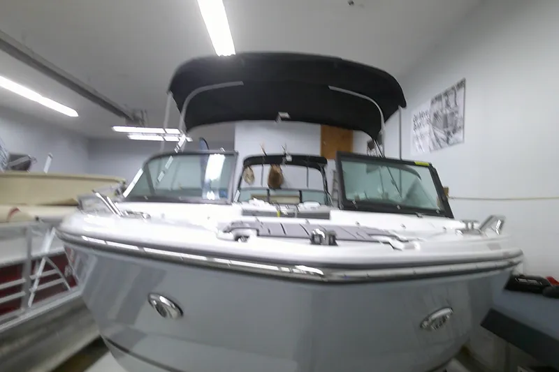Slide: The Image of 2023 Monterey 224 FS Bowrider boat in indoor storage. - 4