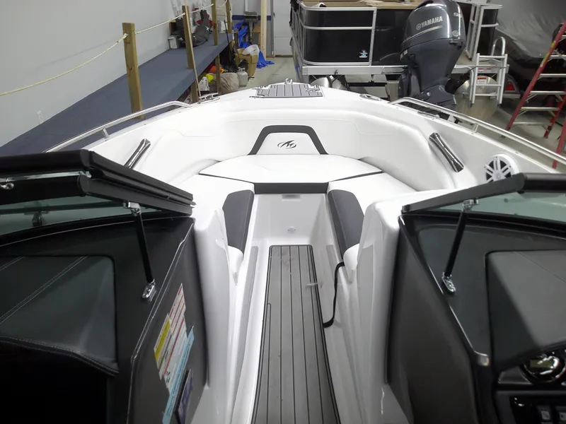 Slide: The Image of 2023 Monterey 224 FS Bowrider boat interior with seating and storage compartments. - 8