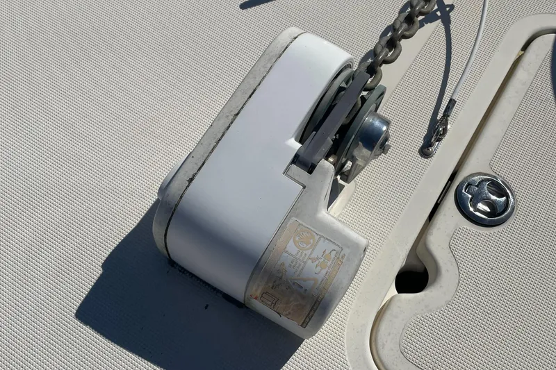 Slide: The Image of Close-up of anchor windlass on 2004 Pursuit 2670 Cuddy Console boat. - 18