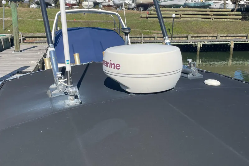 Slide: The Image of 2004 Pursuit 2670 Cuddy Console boat with marine radar on deck. - 20