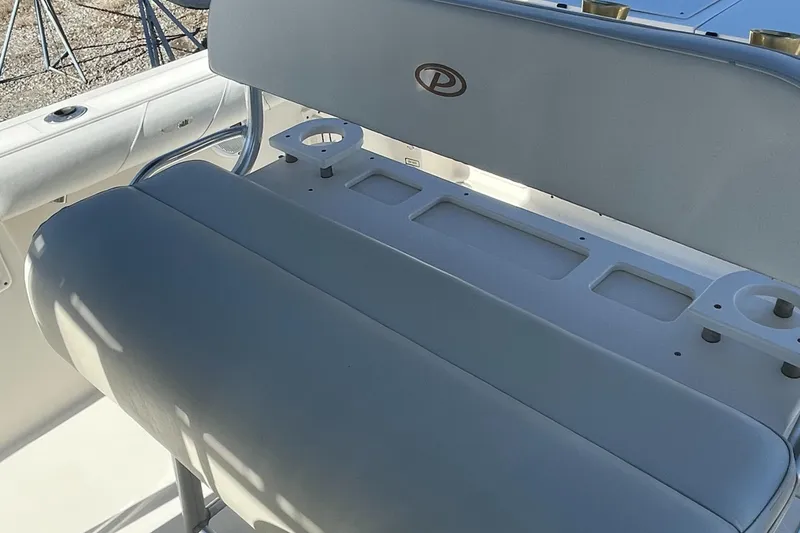 Slide: The Image of 2004 Pursuit 2670 Cuddy Console boat seating and console area. - 35