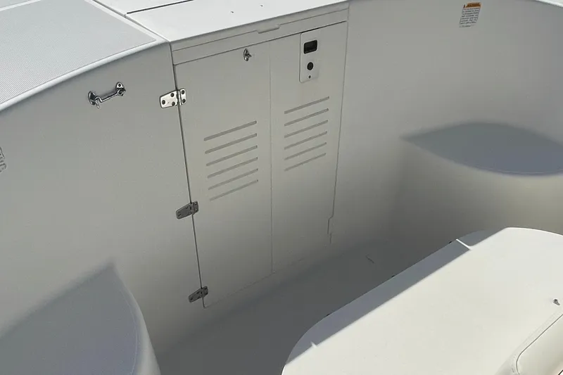 Slide: The Image of 2004 Pursuit 2670 Cuddy Console boat interior storage compartment. - 37