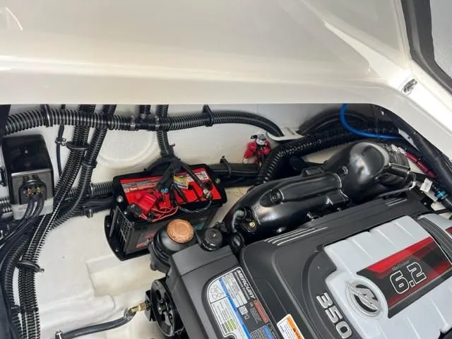 Slide: The Image of 2024 Formula 310 CBR engine compartment with 6.2L 350 HP engine and battery. - 12