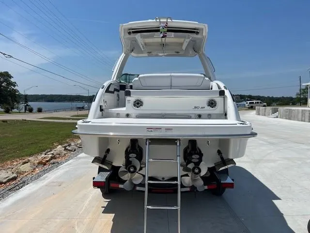 Slide: The Image of 2024 Formula 310 CBR boat, rear view with ladder and dual propellers. - 14