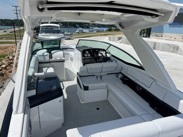 Slide: The Image of 2024 Formula 310 CBR luxury boat interior with spacious seating and modern dashboard. - 15