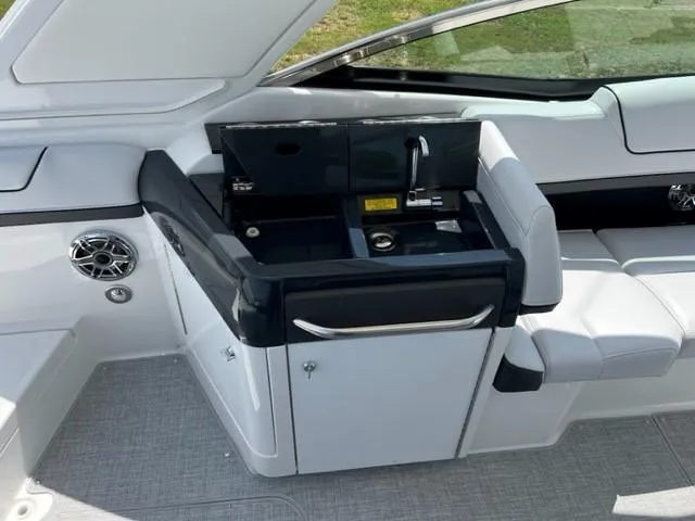 Slide: The Image of 2024 Formula 310 CBR boat interior with sink and seating area. - 18