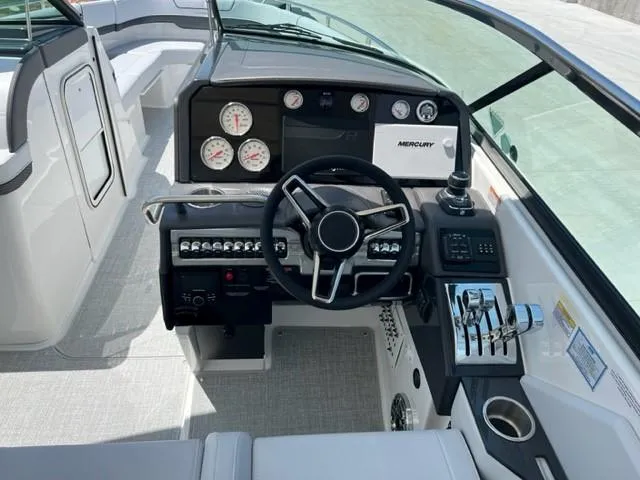 Slide: The Image of 2024 Formula 310 CBR boat cockpit with steering wheel and control panel. - 4