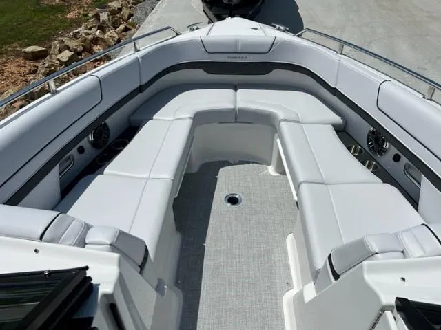 Slide: The Image of 2024 Formula 310 CBR boat with spacious white seating area. - 6