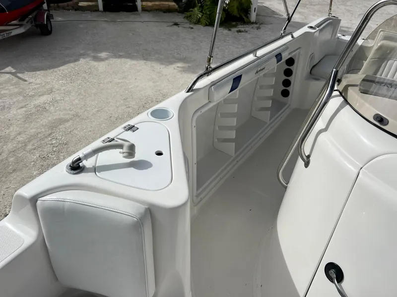 Slide: The Image of 2011 Hurricane 231 boat interior with seating and storage compartments. - 13