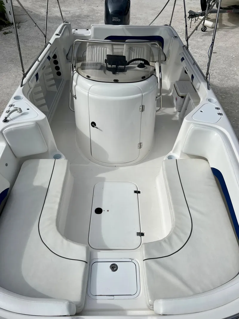 Slide: The Image of 2011 Hurricane 231 boat interior with seating and storage compartments. - 16