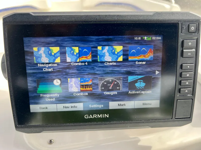 Slide: The Image of Garmin navigation system on a 2011 Hurricane 231 boat displaying various chart options. - 17