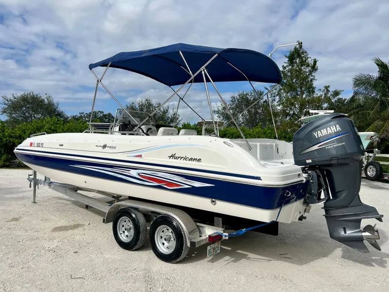 Slide: The Image of 2011 Hurricane 231 boat with Yamaha outboard motor on trailer. - 22