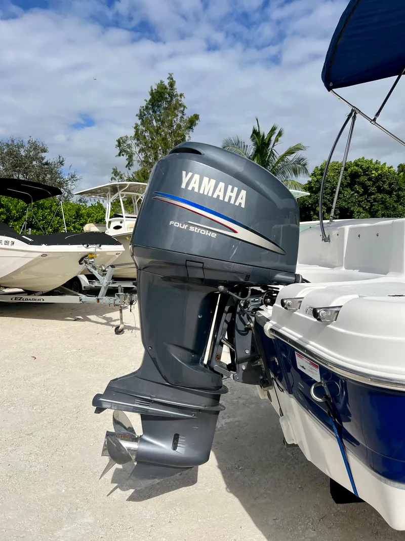Slide: The Image of 2011 Hurricane 231 boat with Yamaha four-stroke outboard motor. - 26