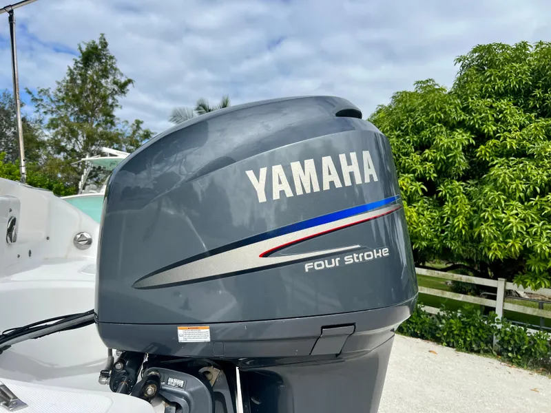 Slide: The Image of Yamaha four-stroke outboard motor on a 2011 Hurricane 231 boat. - 27