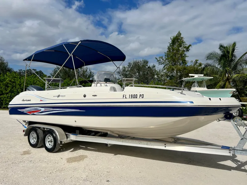 Slide: The Image of 2011 Hurricane 231 boat on trailer with blue canopy. - 4