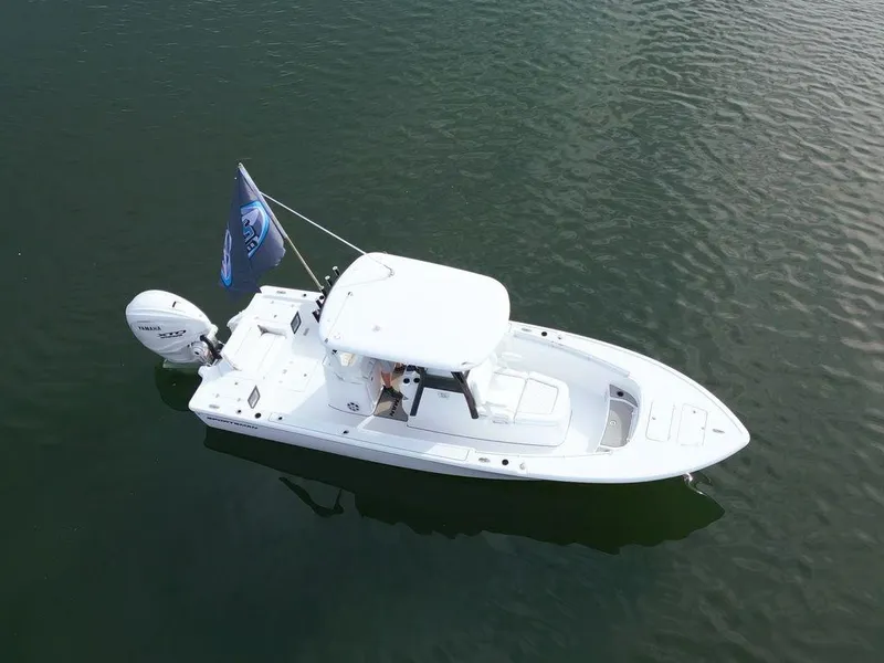 Slide: The Image of 2024 Sportsman Masters 267OE Bay boat on calm water, aerial view. - 16