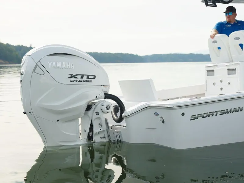 Slide: The Image of 2024 Sportsman Masters 267OE Bay boat with Yamaha XTO Offshore engine on calm water. - 19