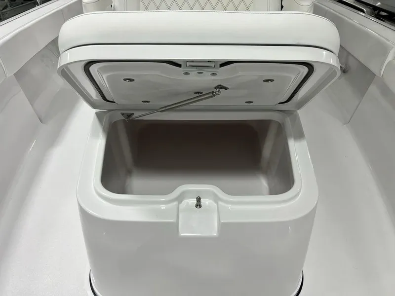 Slide: The Image of 2024 Sportsman Masters 267OE Bay boat storage compartment open. - 21