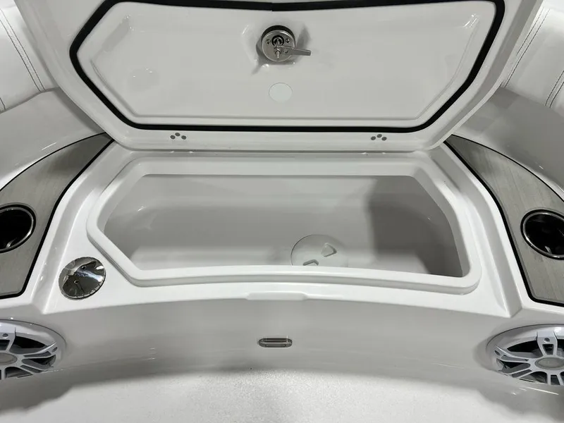 Slide: The Image of 2024 Sportsman Masters 267OE Bay boat storage compartment with cup holders and speakers. - 25