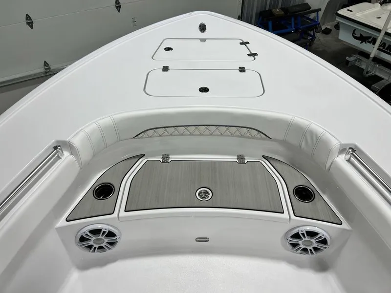 Slide: The Image of 2024 Sportsman Masters 267OE Bay boat interior with storage compartments and speakers. - 26