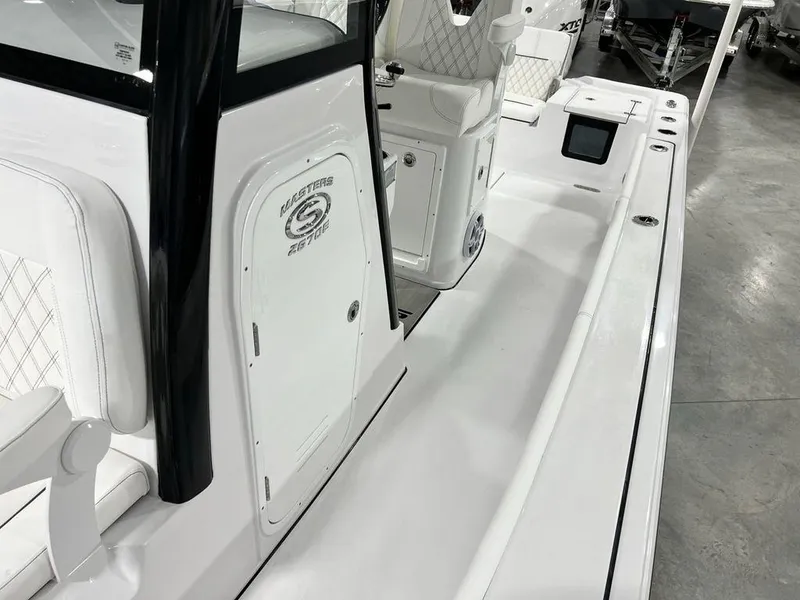 Slide: The Image of 2024 Sportsman Masters 267OE Bay boat interior with sleek white seating and modern console. - 31