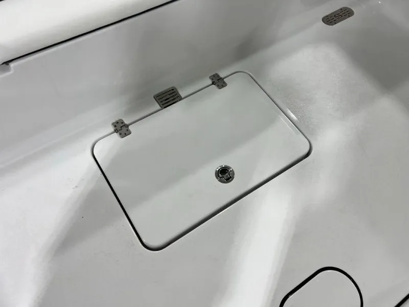 Slide: The Image of 2024 Sportsman Masters 267OE Bay boat deck with storage compartment. - 40