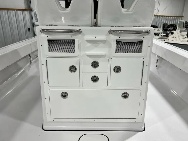 Slide: The Image of 2024 Sportsman Masters 267OE Bay boat storage compartments and seating area. - 45