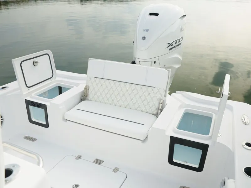 Slide: The Image of 2024 Sportsman Masters 267OE Bay boat interior with seating and storage compartments. - 6