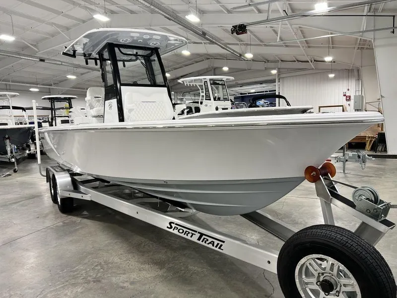 Slide: The Image of 2024 Sportsman Masters 267OE Bay boat on trailer in showroom. - 9