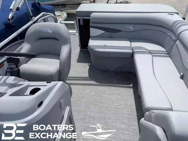 Slide: The Image of 2024 Bennington 188SVL pontoon boat interior with gray seating, showcased by Boaters Exchange. - 3
