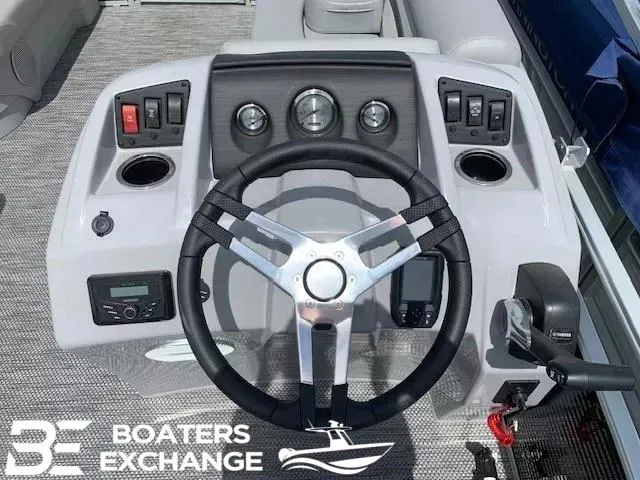 Slide: The Image of 2024 Bennington 188SVL boat dashboard with steering wheel and controls, Boaters Exchange logo. - 5