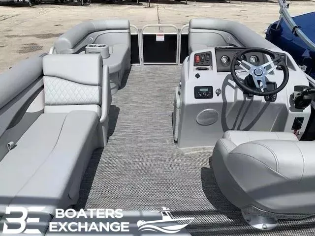 Slide: The Image of 2024 Bennington 188SVL pontoon boat interior with gray seating and steering console. - 6