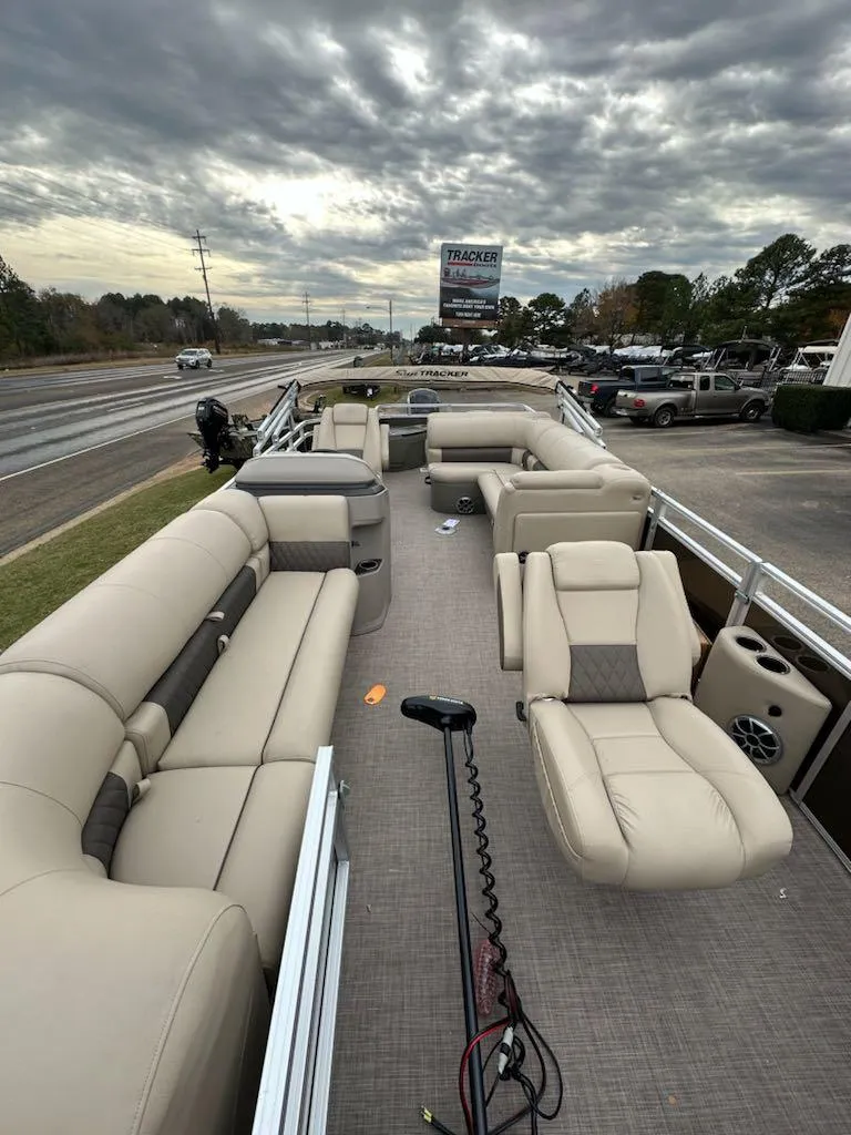 Slide: The Image of 2024 Sun Tracker SportFish 20 DLX pontoon boat with spacious seating and modern amenities. - 5