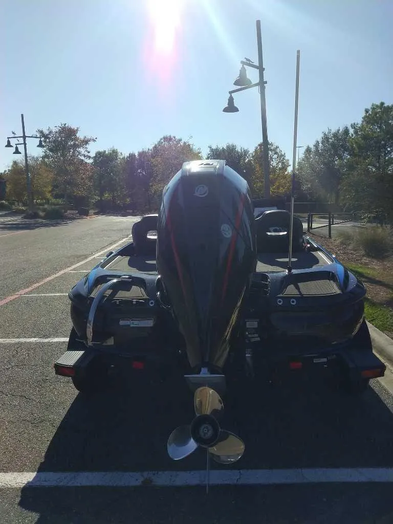 Slide: The Image of 2024 Nitro Z19 Pro boat parked in a sunny lot. - 2