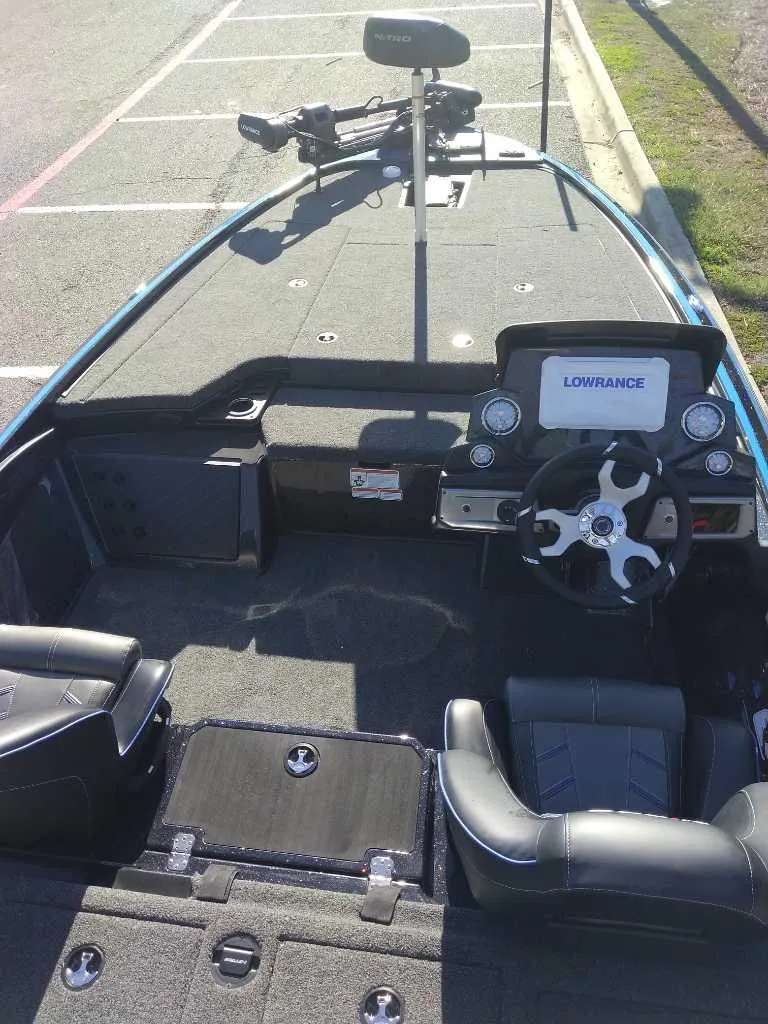 Slide: The Image of 2024 Nitro Z19 Pro boat interior with Lowrance electronics and steering wheel. - 4