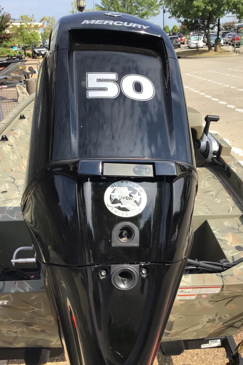 Slide: The Image of 2024 Tracker Grizzly 1648 SC with Mercury 50 HP outboard motor. - 3